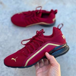 PUMA Women's Axelion Metallic Sneaker in Burgundy Red/Gold